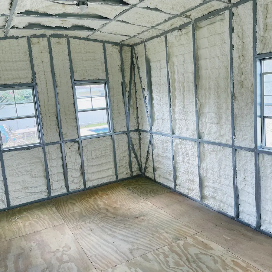 Closed-cell spray foam insulation applied to wall cavities in a residential project in Maynard